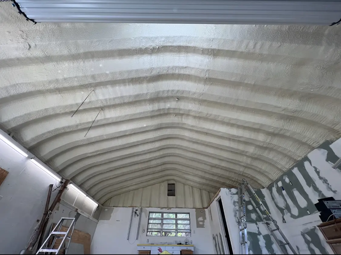 Spray polyurethane foam applied to the underside of a metal roof deck in Wonder Lake